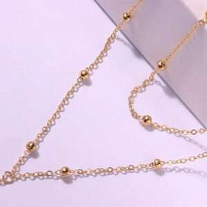 Collier double boules plongeant