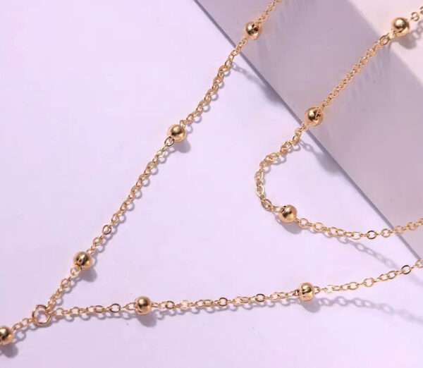Collier double boules plongeant